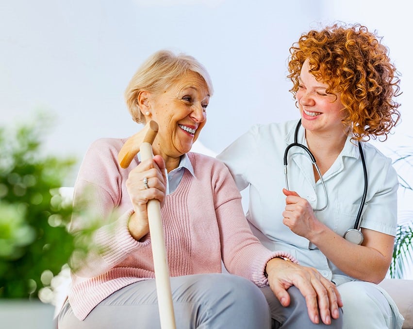 Older lady sat with nurse